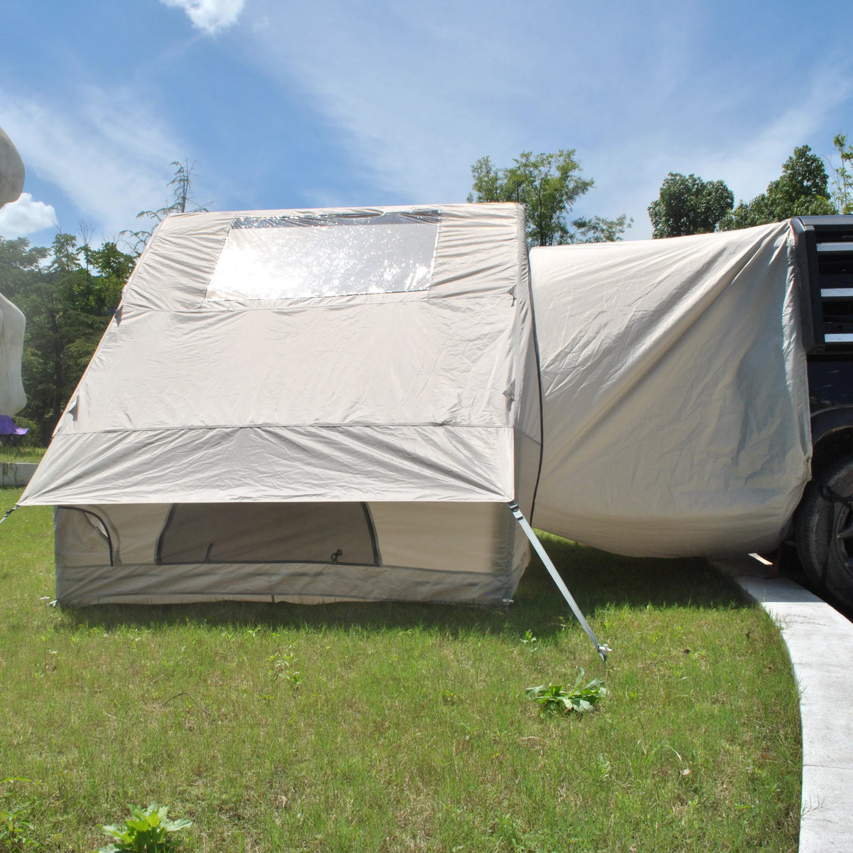 Inflatable Car Camping Tent side view showing the clear panel, covered window and SUV connection sleeve