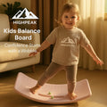 HighPeak Kids Balance Board in soft pink with child balancing barefoot in a cozy living room setting