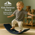 HighPeak Kids Balance Board in navy with a toddler balancing indoors on a soft rug, promoting coordination and motor skills.