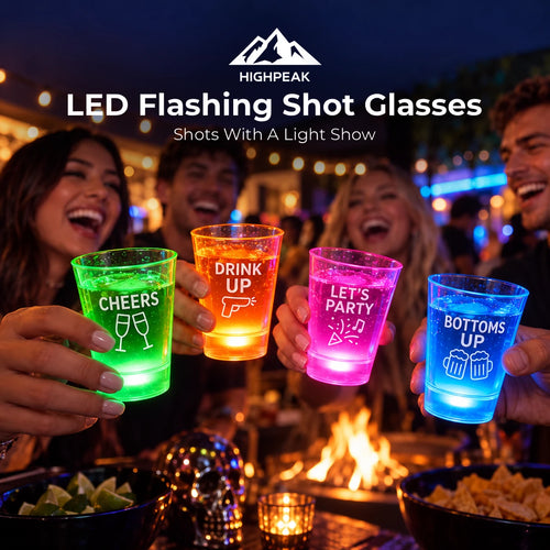 HighPeak LED Flashing Shot Glasses in four glowing colors, raised together for a toast at an outdoor night party.