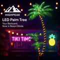 HighPeak LED Palm Tree with glowing green leaves and trunk lights in a vibrant tiki bar backyard setting at night