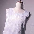 LED Party Tank Top — Unlit white fabric and round neckline close-up