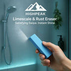 HighPeak Rust & Limescale Cleaning Eraser in blue held against foggy glass shower door removing buildup effortlessly