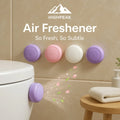 HighPeak Air Fresheners in pastel colors attached to bathroom wall and toilet for long-lasting fresh scent.