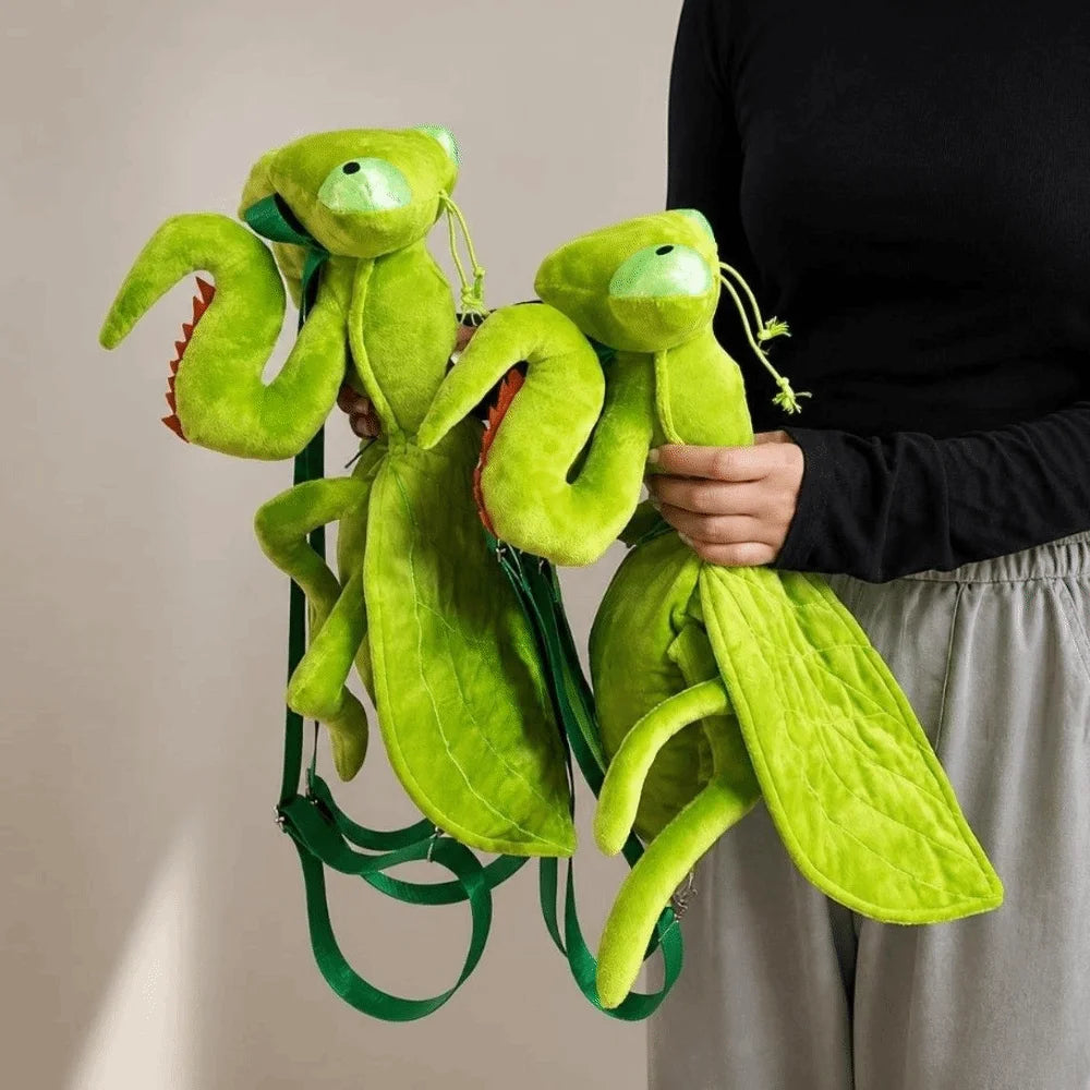 Person holding two green Mantis Plush Backpacks to show front and side details