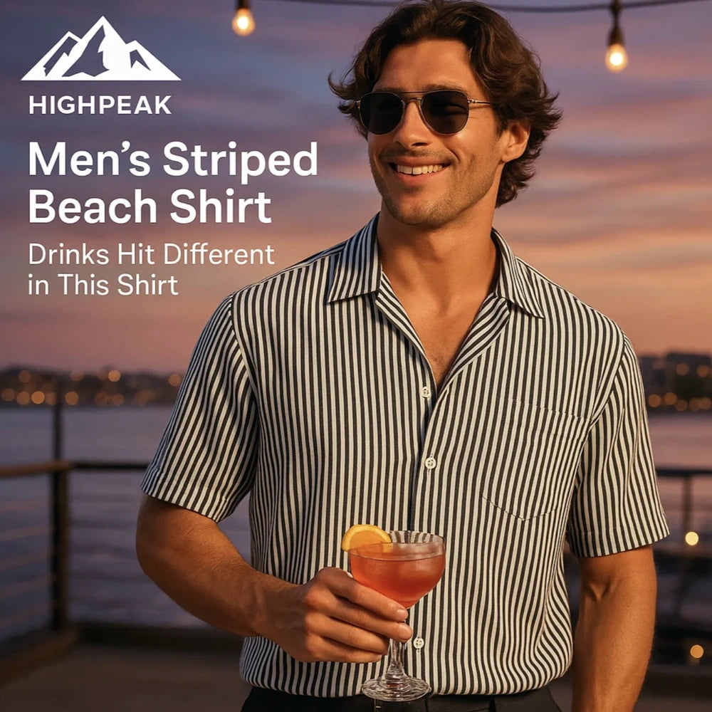 HighPeak Men’s Striped Beach Shirt in black and white worn by man holding cocktail at sunset by waterfront