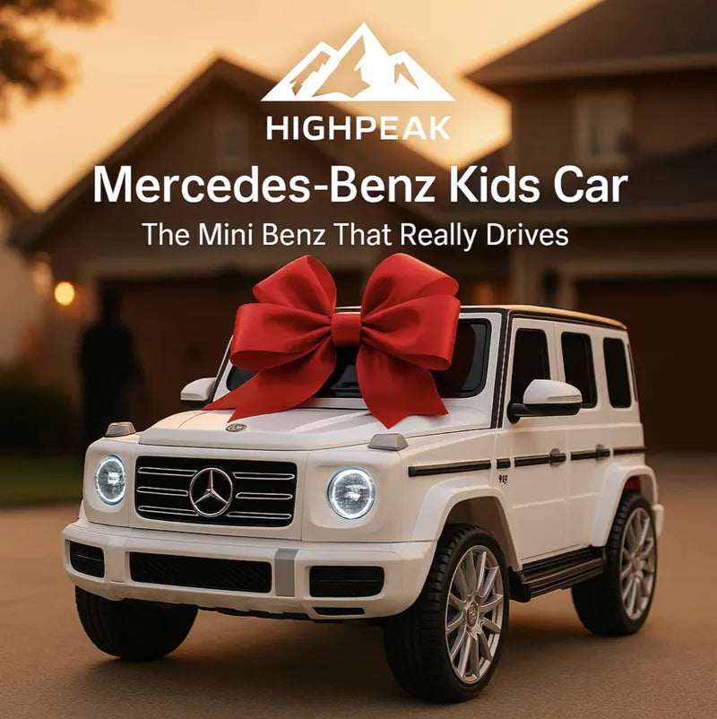 HighPeak Driveable Mercedes-Benz Car in white with headlights on and a red bow outside a suburban home at dusk
