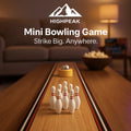 HighPeak Mini Bowling Game with white pins and ball on wooden table in cozy living room setting