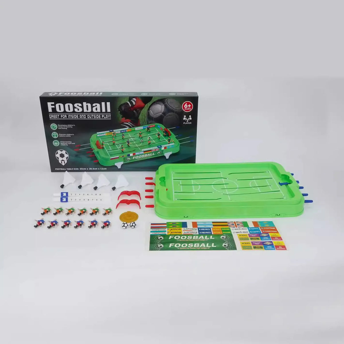 Mini Foosball Table base and loose game components beside packaging showing table dimensions
