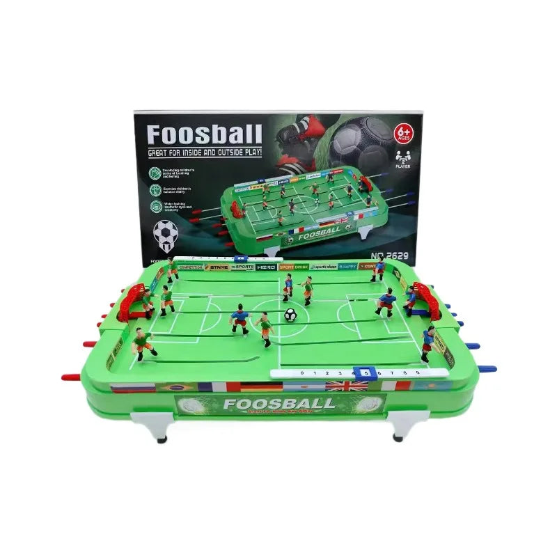 Green Mini Foosball Table with player figures, manual score sliders and retail box on a white background