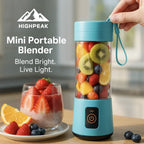 HighPeak Mini Portable Blender in blue with mixed fruit inside, showing digital display and carry strap on wooden table.