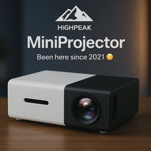 HighPeak MiniProjector in sleek black and white design with HD lens on wooden surface - compact home theater projector
