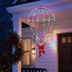 Multicolor Parachuting Santa Lights shown hanging at a festive front porch in an additional supplier image.