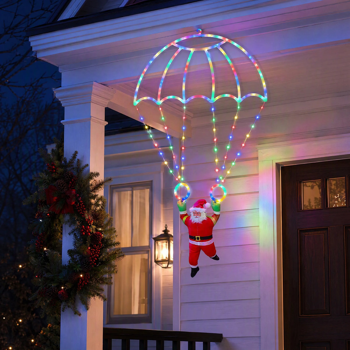 Multicolor Parachuting Santa Lights hanging above a Christmas porch with a glowing parachute and Santa figure.