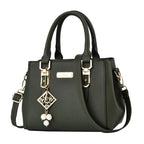 Pebbled Charm Shoulder Purse in green with pebbled texture, top handles and a long shoulder strap.