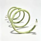 Extended green Plush Cat Spiral Toy in a front angled view on a white background