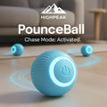 HighPeak PounceBall in blue with glowing power button rolling on wooden floor for cat chase play indoors