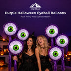 Purple Halloween Eyeball Balloons surrounding two friends in black costumes at a pumpkin-decorated party.