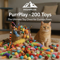 HighPeak PurrPlay™ 200-piece colorful cat toy mega pack with a wicker basket and an orange tabby cat indoors