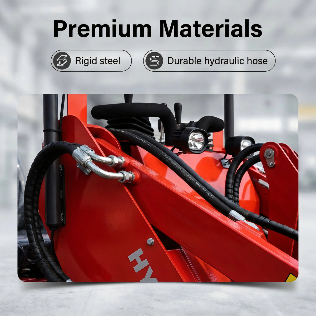 Close-up of hydraulic hose connections, red steel loader arm and controls on the ride-on skid steer