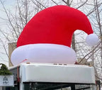 Giant Inflatable Santa Hat installed on a vehicle roof