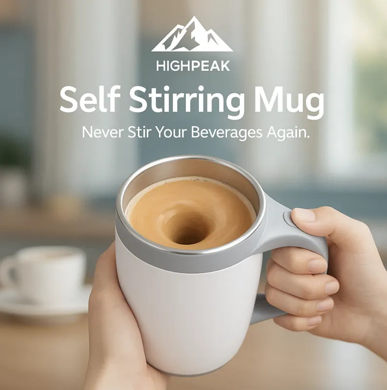 HighPeak Self Stirring Mug in gray and white held in hands with coffee mixing inside, kitchen background visible