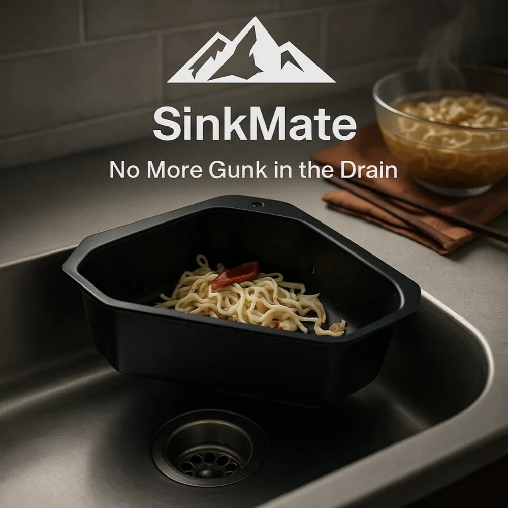 SinkMate™ - Corner Strainer Basket in black plastic placed in stainless steel sink corner with noodles, kitchen countertop scene