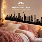 Skyline Wall Decal above a cozy pink bed with a black city silhouette and HighPeak branding