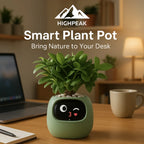 HighPeak Smart Plant Pot in green with animated face on screen, placed on wooden desk near laptop and coffee cup