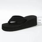 Black Solea Platform Flip Flop with a 5.5 cm heel height measurement