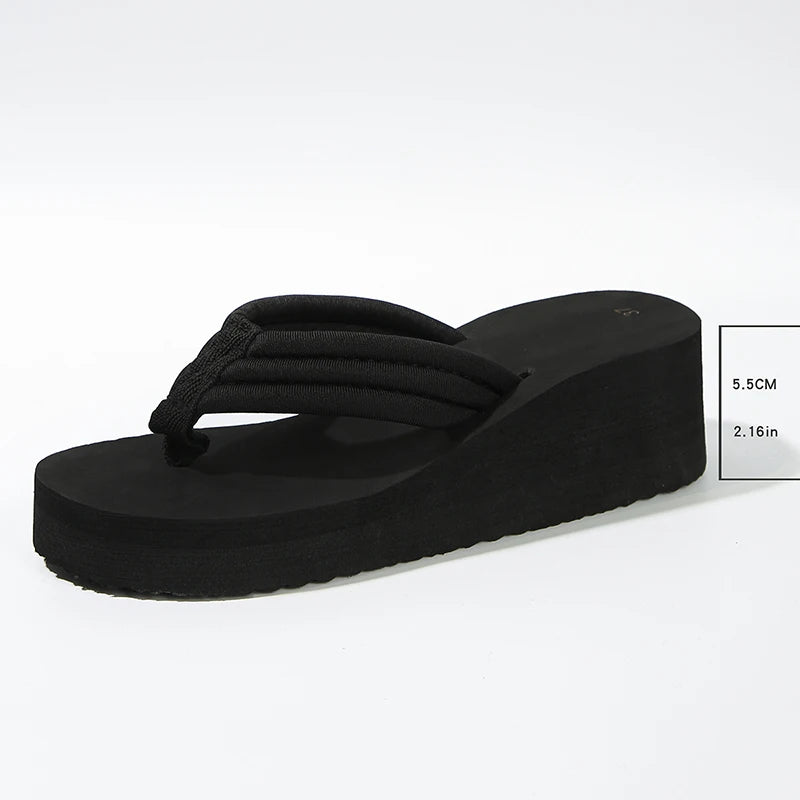 Black Solea Platform Flip Flop with a 5.5 cm heel height measurement