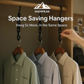 HighPeak Space-Saving Clothes Hangers in black holding five shirts each on a wooden closet rod for efficient storage