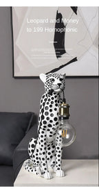 White Spotted Cheetah Premium Lamp shown with its bulb off beneath supplier promotional text in a living-room setting.