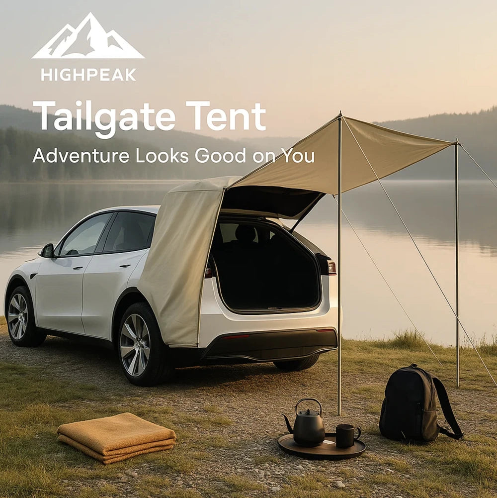 HighPeak Tailgate Tent in beige attached to white SUV by lakeside with awning providing shade and camping gear nearby