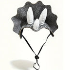 Gray Triceratops pet costume headpiece with three white horns, broad frill and adjustable black chin cord