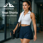 HighPeak Yoga Shorts in navy blue with high waist and light-reflective dots worn by a woman post-workout