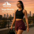HighPeak Yoga Shorts in maroon with high waist and light-reflective dots worn by woman jogging at sunset outdoors