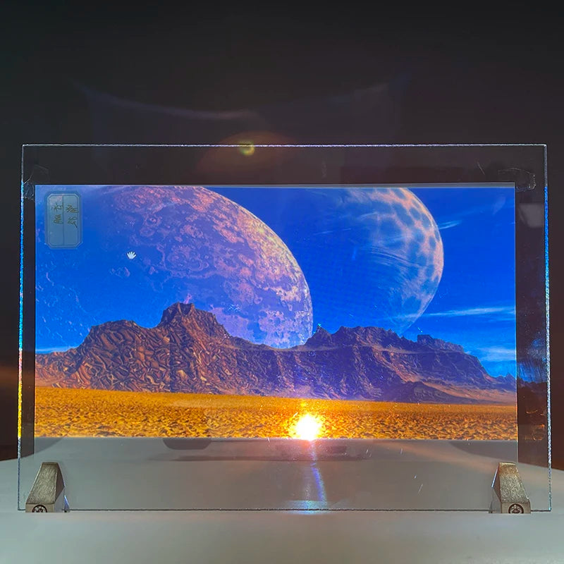 Holographic Window Projection Film glass-mounted demonstration showing planets above a rocky landscape.