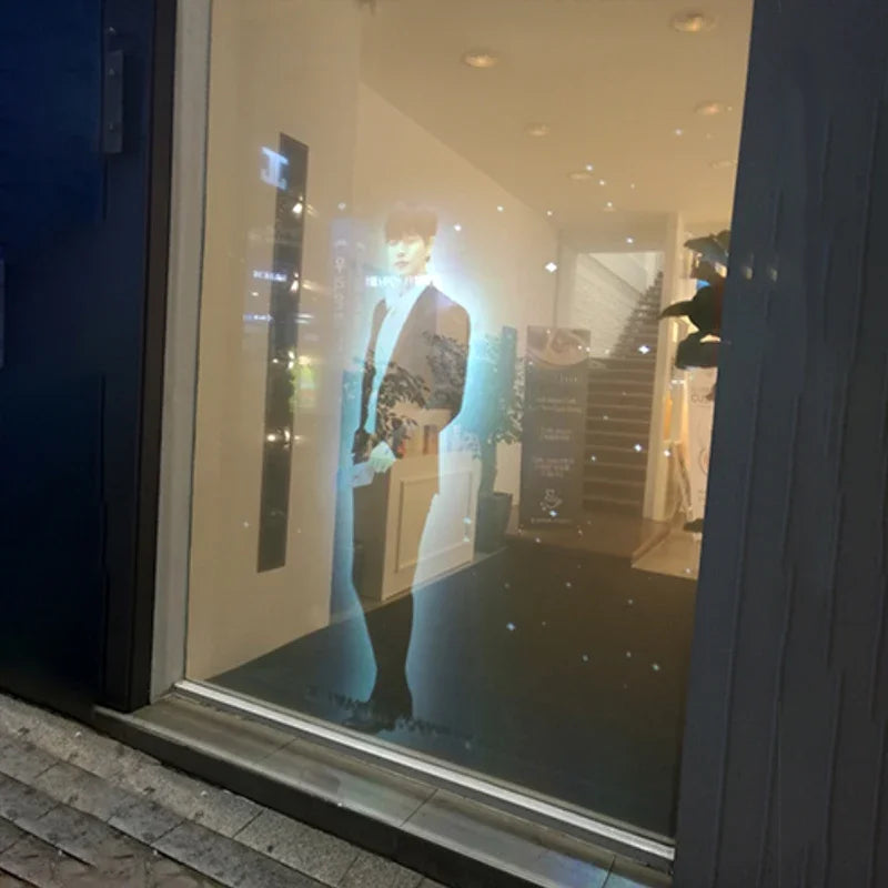Holographic Window Projection Film showing a projected person on a shop window.