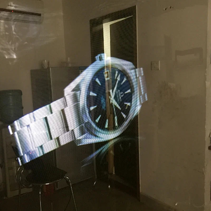 Holographic Window Projection Film showing a wristwatch projected onto a transparent indoor panel.
