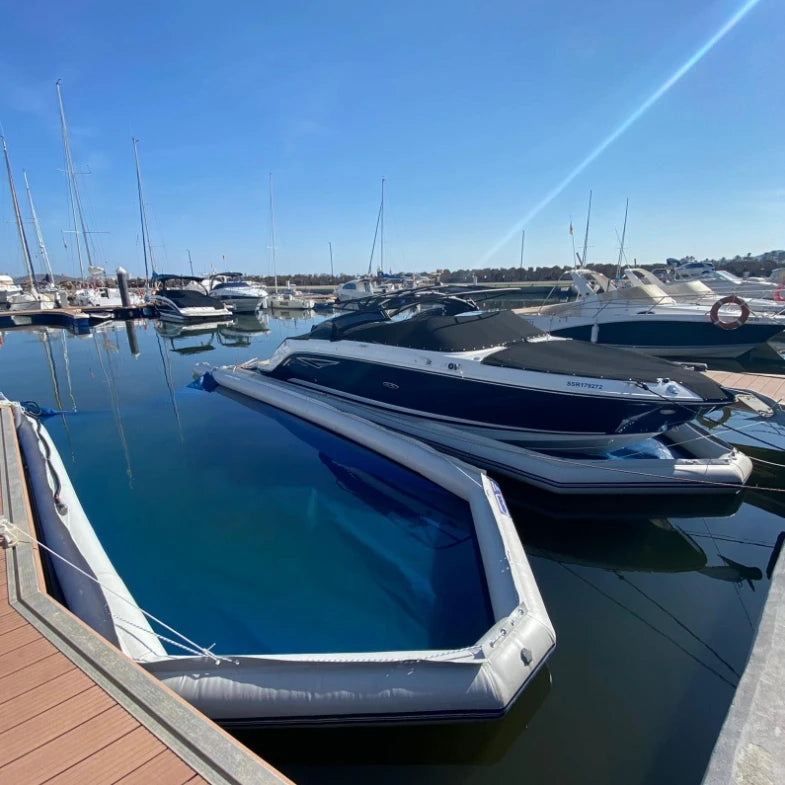 Inflatable Boat Dry Dock shown empty with a blue floor at a marina