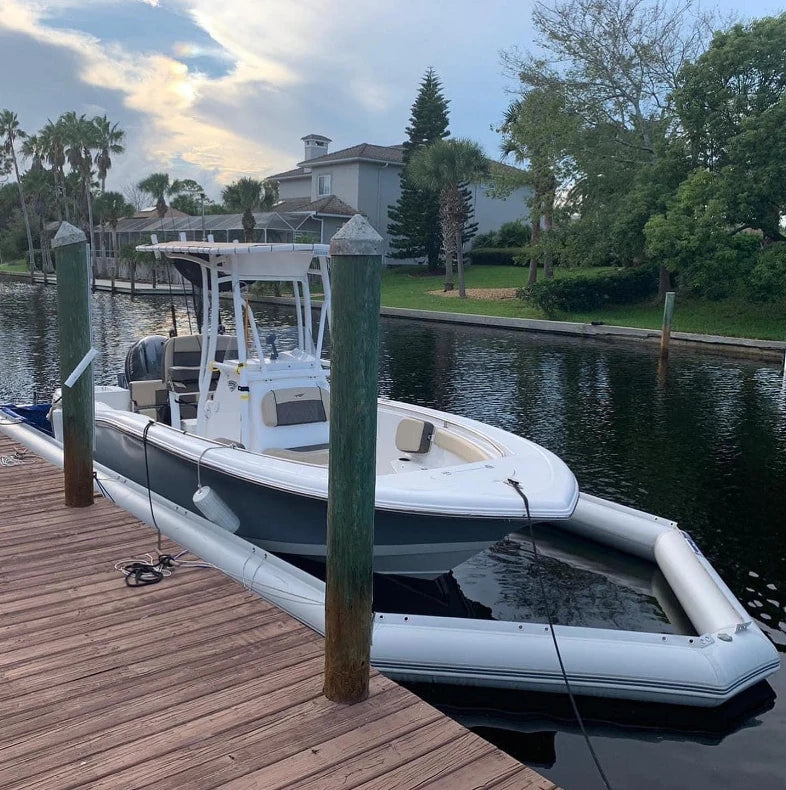 Inflatable Boat Dry Dock and center-console boat secured beside a private residential pier