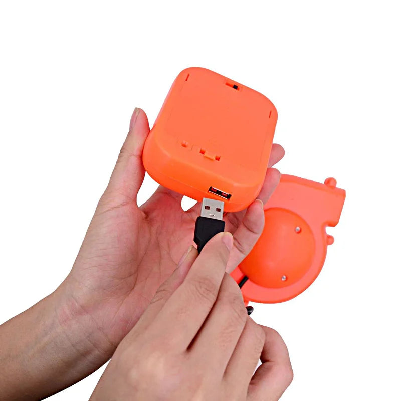 Inflatable Flamingo Costume blower detail showing hands connecting the USB plug to the orange battery holder.