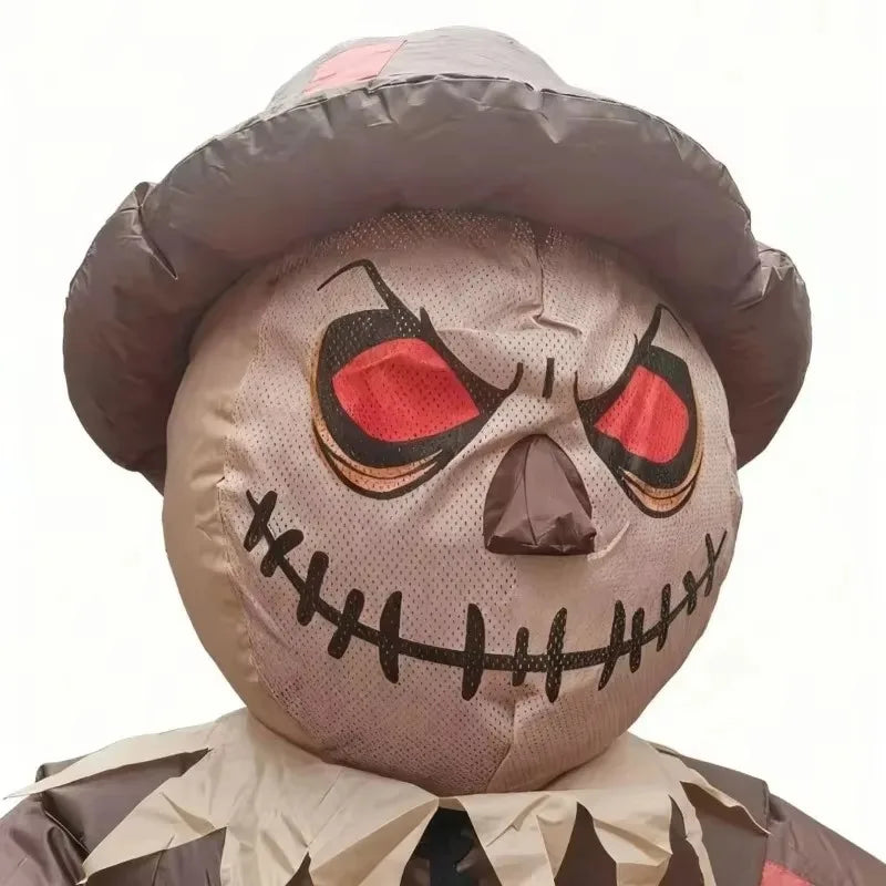 Inflatable Scarecrow Costume face close-up showing printed red eyes, a stitched smile, and a wide-brim hat.