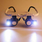 Jeweler Magnifying Glasses standing on a surface with both LED lights switched on