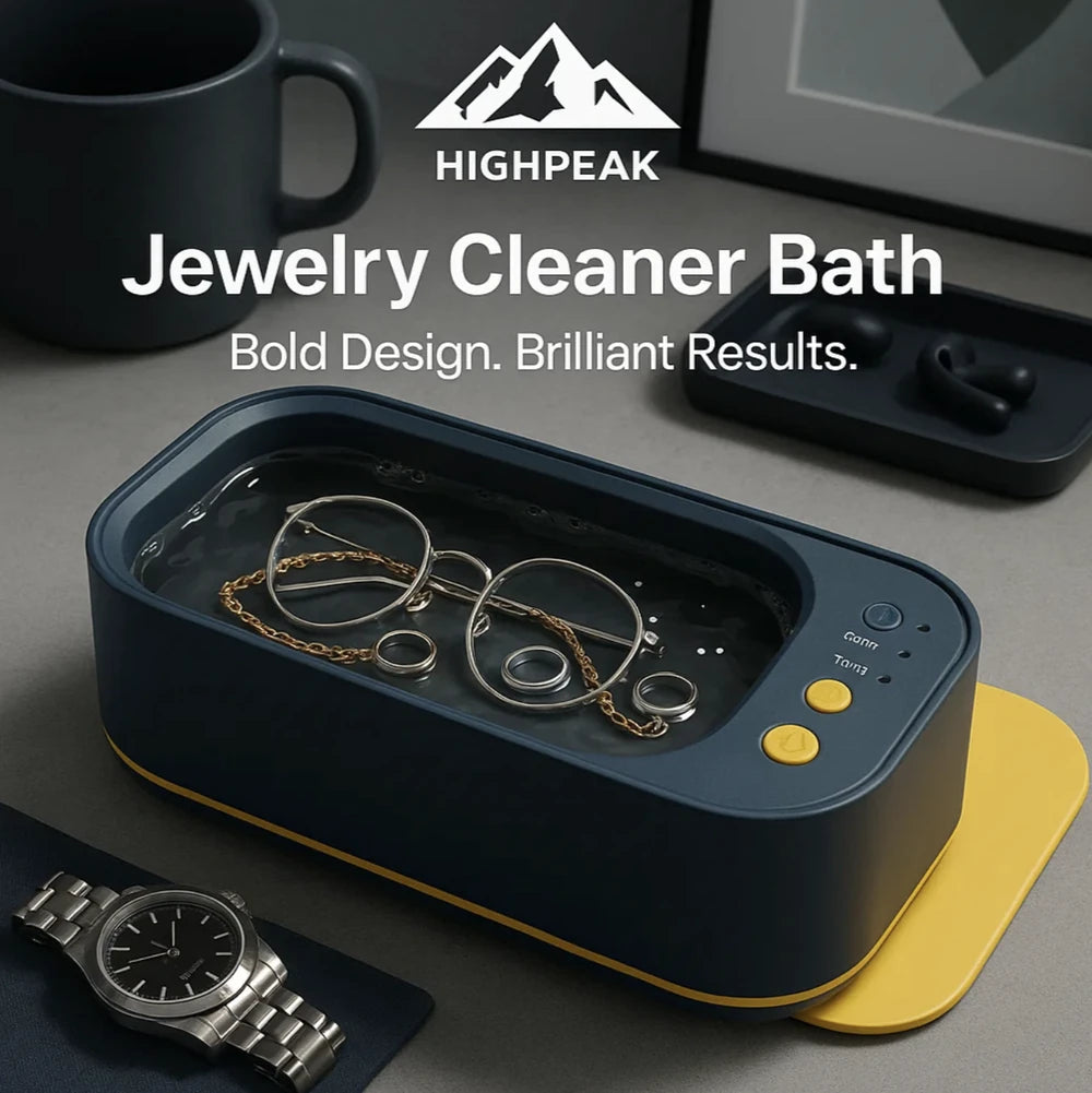 HighPeak Jewelry Cleaner Bath in navy blue with gold tray cleaning glasses and rings on a modern desk setup