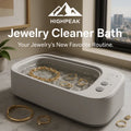 HighPeak Jewelry Cleaner Bath ultrasonic cleaner in white with gold jewelry in water on marble countertop by window