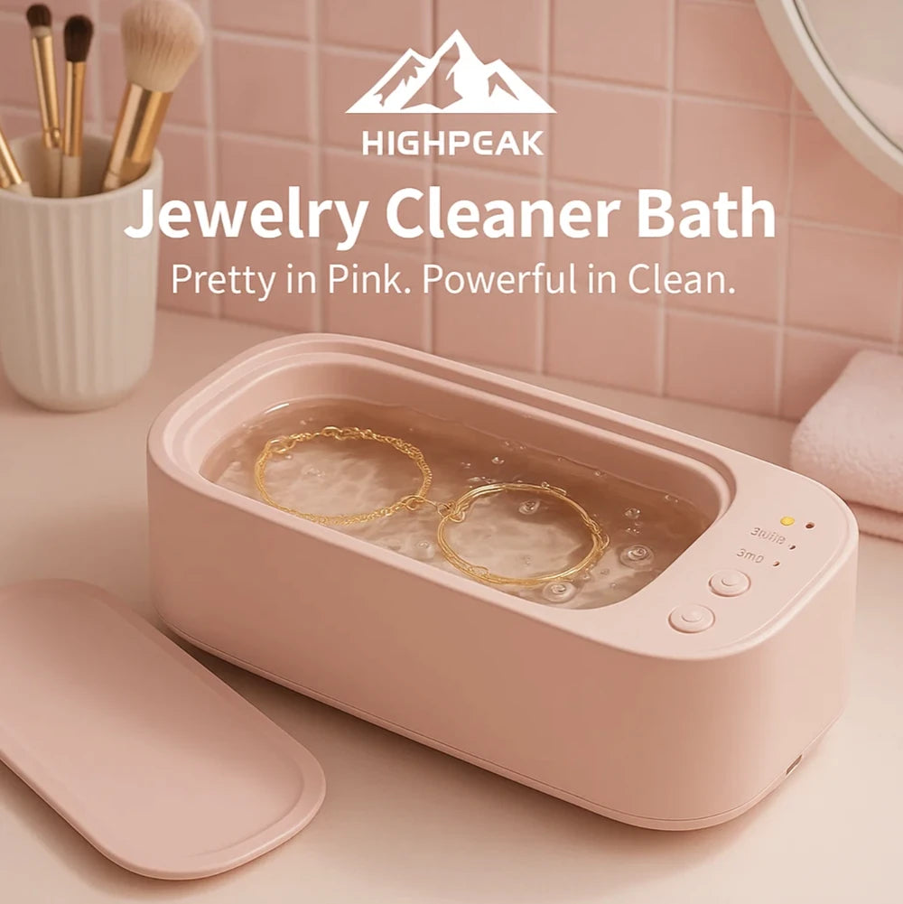 HighPeak Jewelry Cleaner Bath in pink ultrasonic cleaner with gold rings inside on a bathroom counter