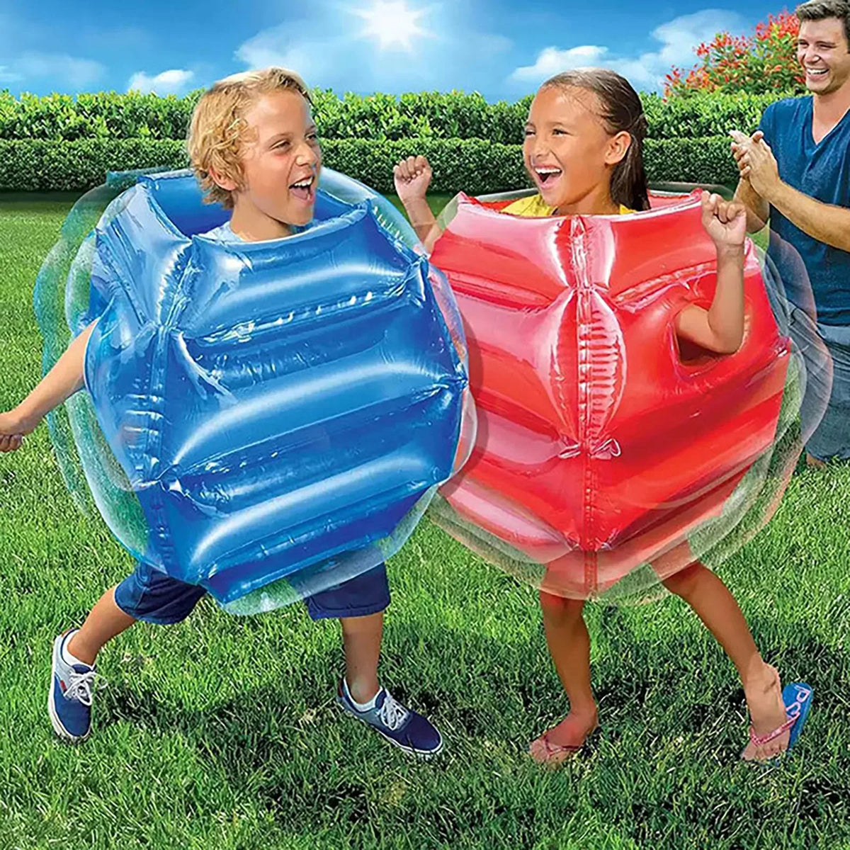 Kids Inflatable Bumper Ball in both colors worn by children with an adult watching their backyard game.