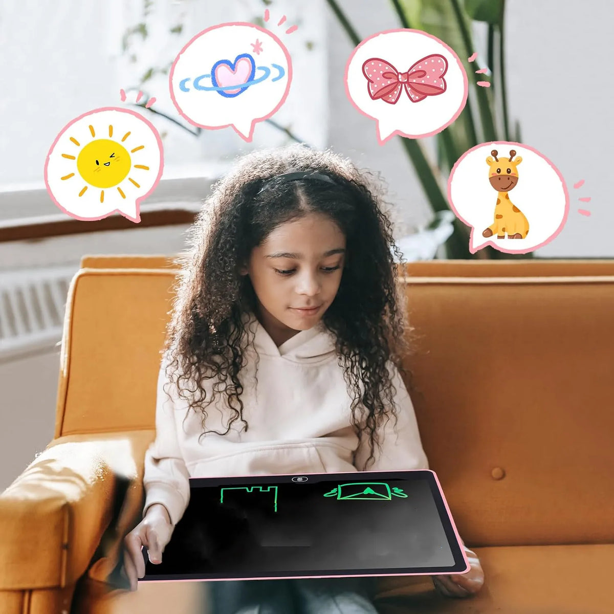 Child drawing on a pink-backed Kids LCD Drawing Tablet while seated on a sofa